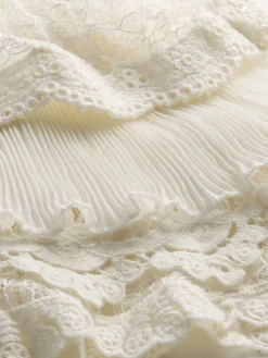 DELAINA TOP WITH RUFFLE CUFF